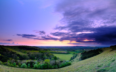 Summer sunset over Meon Valley towards Beacon Hill and Old Winchester Hill, South Downs National Park