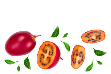 Fresh tamarillo fruit with leaves isolated on white background with copy space for your text. Top view. Flat lay