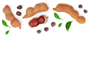 Tamarind fruit with leaf and seed isolated on white background with copy space for your text. Top view. Flat lay