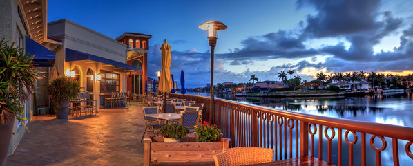 Outdoor dining at the Village at Venetian Bay at sunrise in Naples
