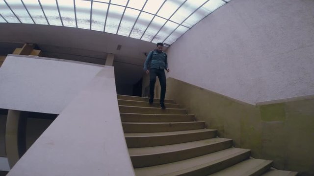 Man in dark boots and jeens going up the concrete stairs tourist travel city outdoors people street tourism beautiful building europe guy lifestyle urban view architecture slow motion