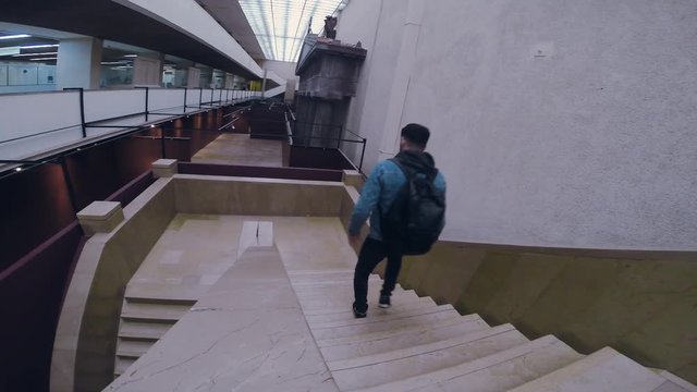Man in dark boots and jeens descends down the stairs tourist travel city outdoors people street tourism beautiful building europe guy lifestyle urban view architecture slow motion