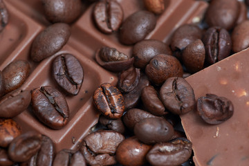 Pieces of dark chokolate and coffee beans