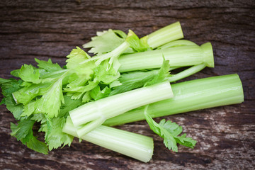 Fresh vegetable of Celery sticks and leaf / Bunch of celery stalk on rustic wood