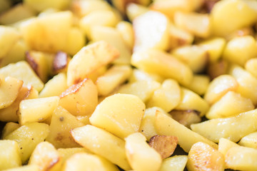Potatoes Fried potatoes in pan Roasted golden crispy potato slices