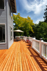 Brand new red cedar outdoor wooden patio during nice weather