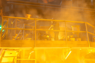 operator working in metallurgical engineering at manufactory of steel plant  