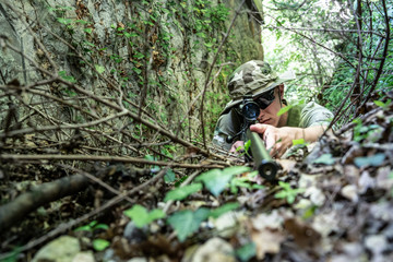Close up on SWAT special military police force Sniper aiming to the target in combat action anti Terrorist intervention