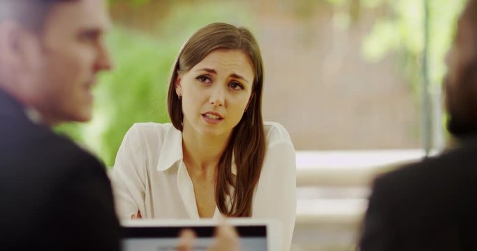 4K Serious & unfriendly recruiters rejecting businesswoman at job interview. Slow motion.