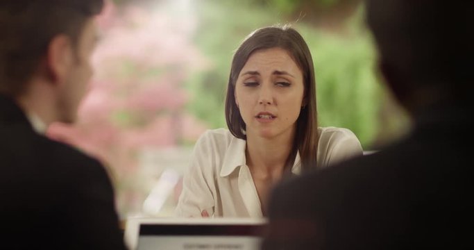 4K Businesswoman close to tears, being told she's losing her job. Slow motion.