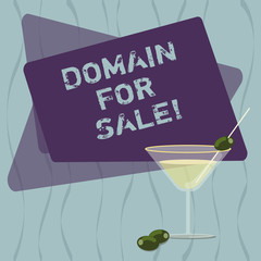 Conceptual hand writing showing Domain For Sale. Business photo text Website available to be purchased webpage not being used Filled Cocktail Wine Glass with Olive on the Rim Text Space