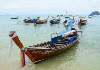 Thai long-tail wooden boat on blue sea