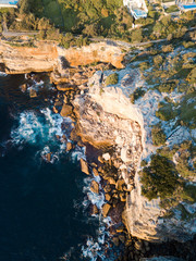 Top down aerial view of a rock cliff.
