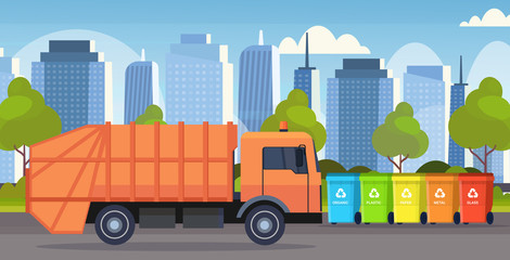 Obraz na płótnie Canvas orange garbage truck urban sanitary vehicle loading recycling bins segregate waste sorting management concept modern cityscape background flat horizontal