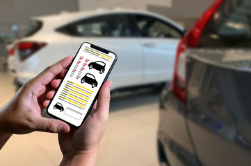 Car service Holding the check list while car mechanic fixing new car engine The powerful engine of a car