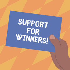 Text sign showing Support For Winners. Conceptual photo give assistance to showing demonstrating who won competition Drawn Hu analysis Hand Holding Presenting Blank Color Paper Cardboard photo