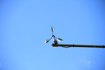An anemometer is a device used for measuring wind speed, and is also a common weather station instrument.