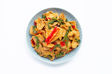 Stir-fried hot and spicy pork with basil on white