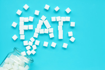 Cubes of sugar on a blue background. 