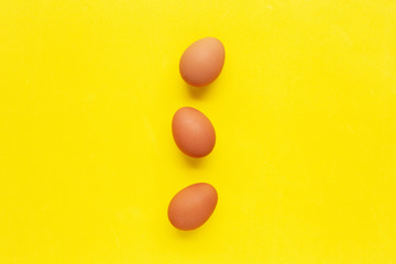 Eggs on yellow background.