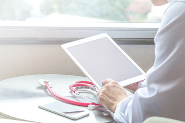 Healthcare professional medical doctor using tablet and smartphone for consult patient online: Physician working tele-consultation: Hospital e-healthcare professionalism Digital health care concept.