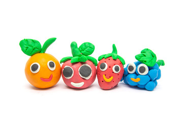 Play dough Fruit imitation on white background. Handmade clay plasticine