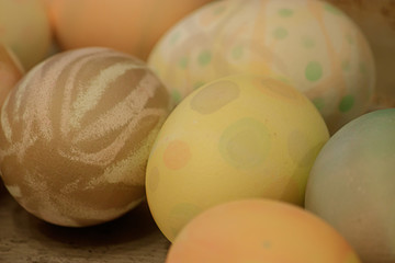 many multicolored eggs with different patterns decorated and dyed for easter