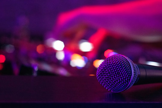 A Microphone Rests On A Desk As A DJ Works The Turn Tables At A Night Club In Downtown Austin, TX.