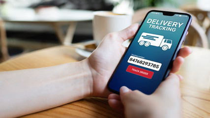 Delivery tracking application form on mobile phone screen. Business and service concept.