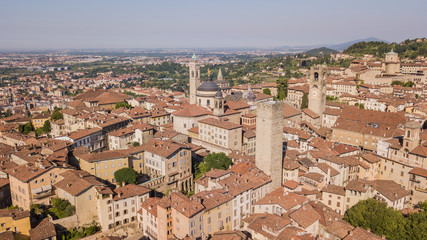Obraz premium Bergamo, Italy. Amazing drone aerial view of the old town. Landscape at the city center, its historical buildings and the towers
