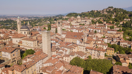 Obraz premium Bergamo, Italy. Amazing drone aerial view of the old town. Landscape at the city center, its historical buildings and the towers
