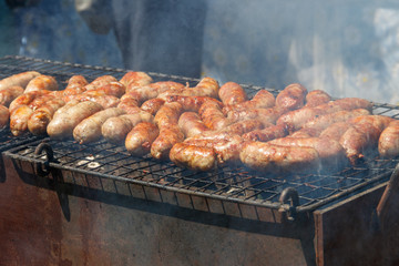 Sausages cooking on a grill