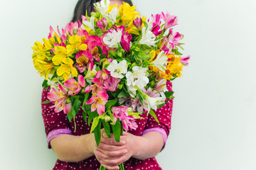 woman  holding Alstroemeria flowers bouquet