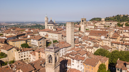 Obraz premium Bergamo, Italy. Amazing drone aerial view of the old town. Landscape at the city center, its historical buildings and the towers