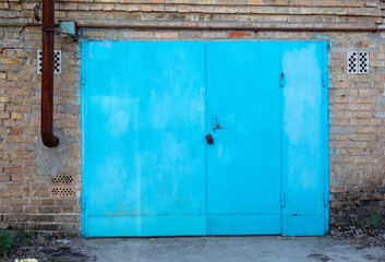 old metal door to the car garage