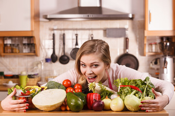 Obraz na płótnie Canvas Woman having vegetables on table