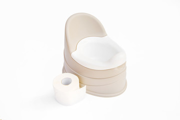 Children's pot beige with removable bowl stands on a light background and next to a roll of toilet paper