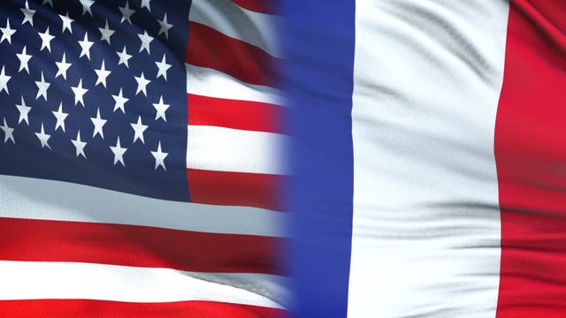 USA and France officials exchanging confidential envelope, flags background