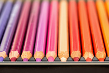 Set of colored pencils. Colored pencils for drawing different colors in box.Macro photo.