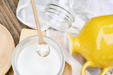 Kefir grains on wooden spoon, Healthy fermented food, Probiotic nutrition drink for good balance digestive system.