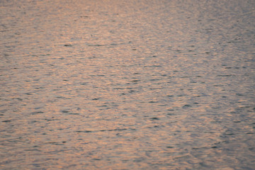 beautiful water wave pattern sunset and reflections