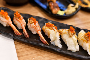 Japanese traditionally food, Delicious nigiri sushi top with fresh seafood, ebi shrimp, engawa fish, Healthy raw diet food.