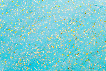 Fototapeta na wymiar Abstract textured background slime with golden glitter
