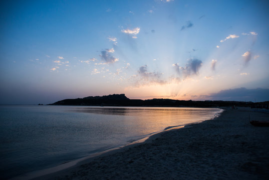 Sunset on the Beach of Rena di Ponente, Sardinia Island.