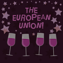 Handwriting text The European Union. Concept meaning EU to which the member states of the EEC are evolving Filled Cocktail Wine Glasses with Scattered Stars as Confetti Stemware