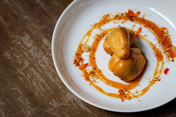 Salacca with sweet spicy sauce. Salacca or Snakefruit is a species of palm trees native to Southeast Asia and the Eastern Himalayas. It has a sweet and sour taste. 