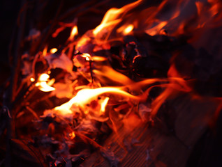 Background of a red flame of a fire at night. Cropped shot, horizontal, close-up, free space. The concept of forest safety.