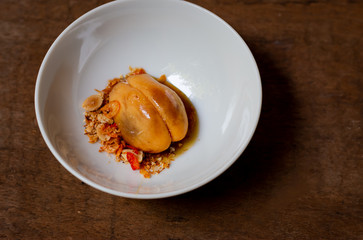 Salacca with sweet spicy sauce. Salacca or Snakefruit is a species of palm trees native to Southeast Asia and the Eastern Himalayas. It has a sweet and sour taste. 