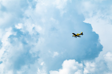 Small Yellow Airplane in flight