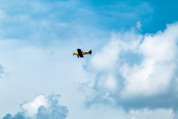 Small Yellow Airplane in flight